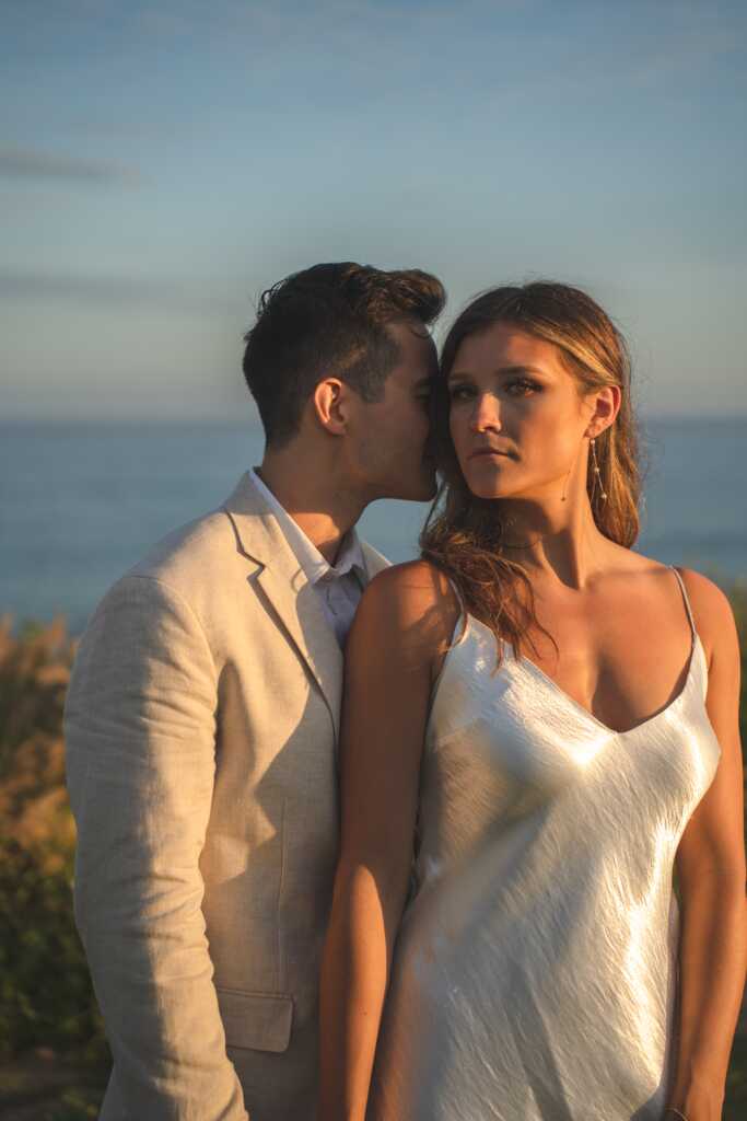 Couple enjoying their wedding day on the beaches of Secrets Puerto Los Cabos at sunset, capturing the romance and beauty of a destination wedding in Los Cabos.