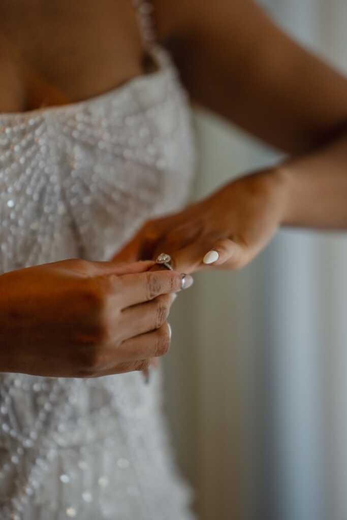 Bride wearing wedding ring Hacienda Encantada Cabo wedding