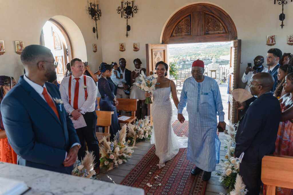 Bride walking down the aisle with father Hacienda Encantada Los Cabos wedding