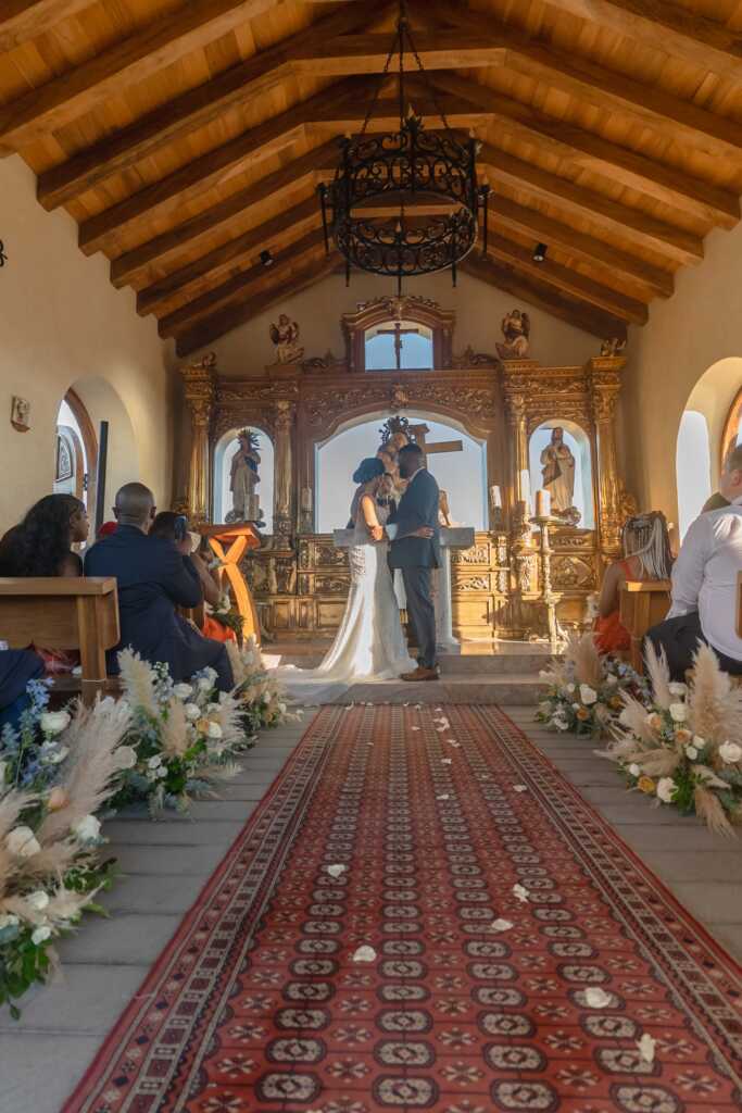 You may kiss the bride moment Hacienda Encantada Los Cabos wedding ceremony