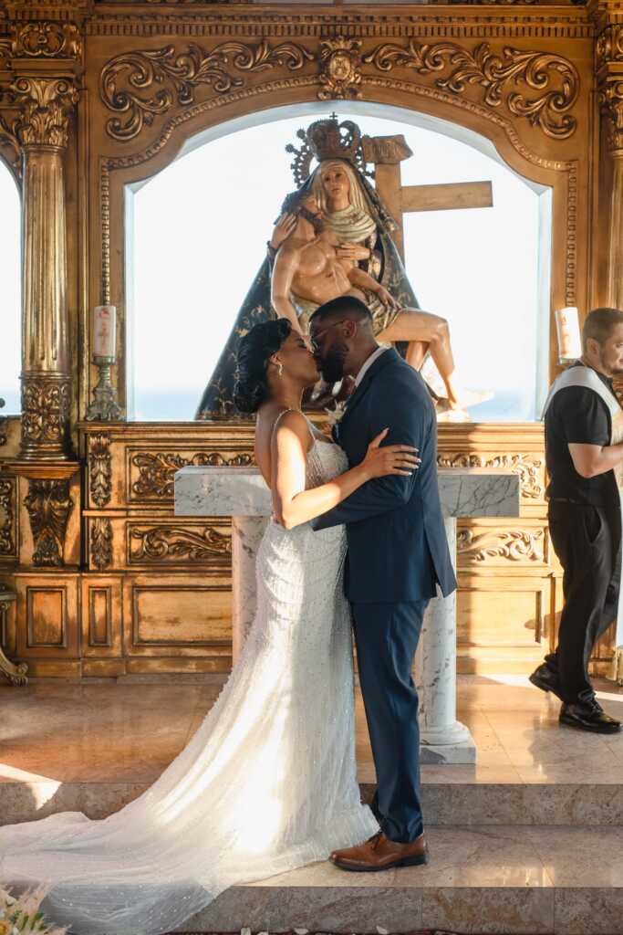 Bride and groom kiss ceremony Hacienda Encantada Cabo wedding