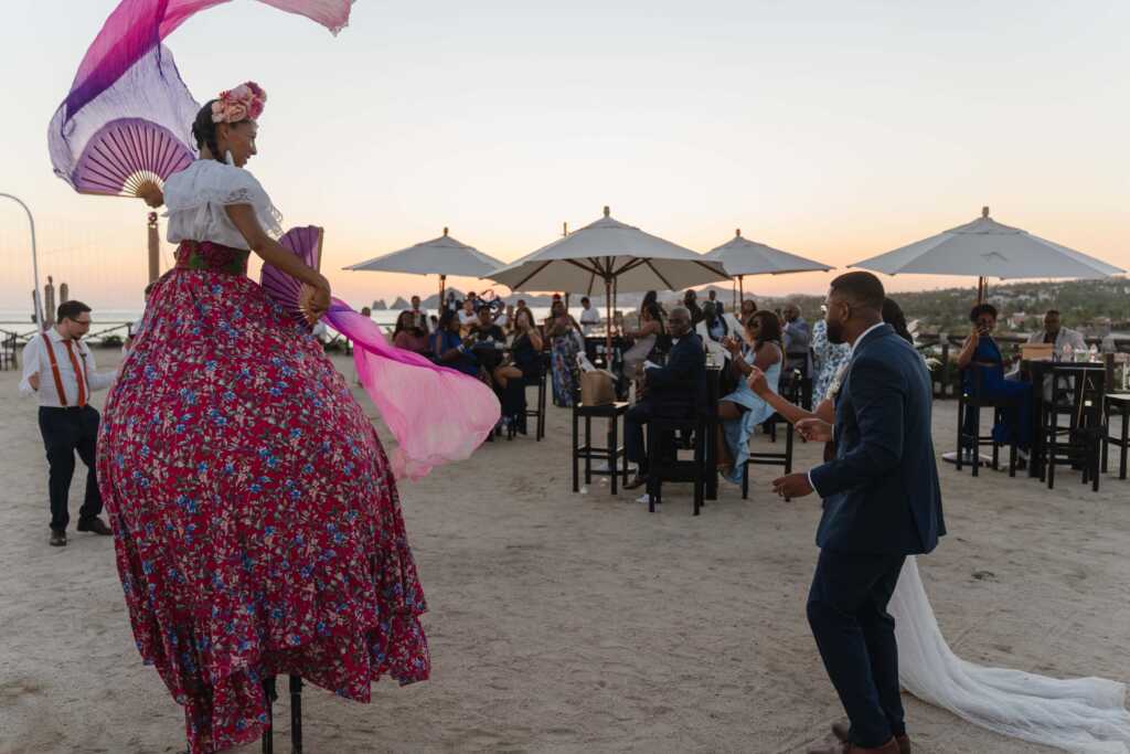 Guests enjoying cocktail hour with dancer Hacienda Encantada Los Cabos
