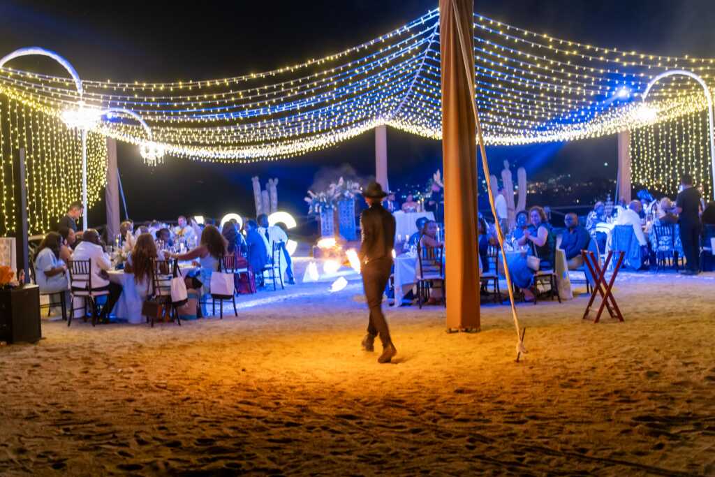 Fire dancer entertainment during dinner Hacienda Encantada Los Cabos wedding