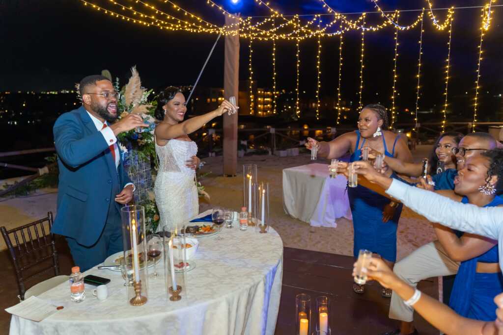 Wedding toast at sweetheart table Hacienda Encantada Los Cabos reception