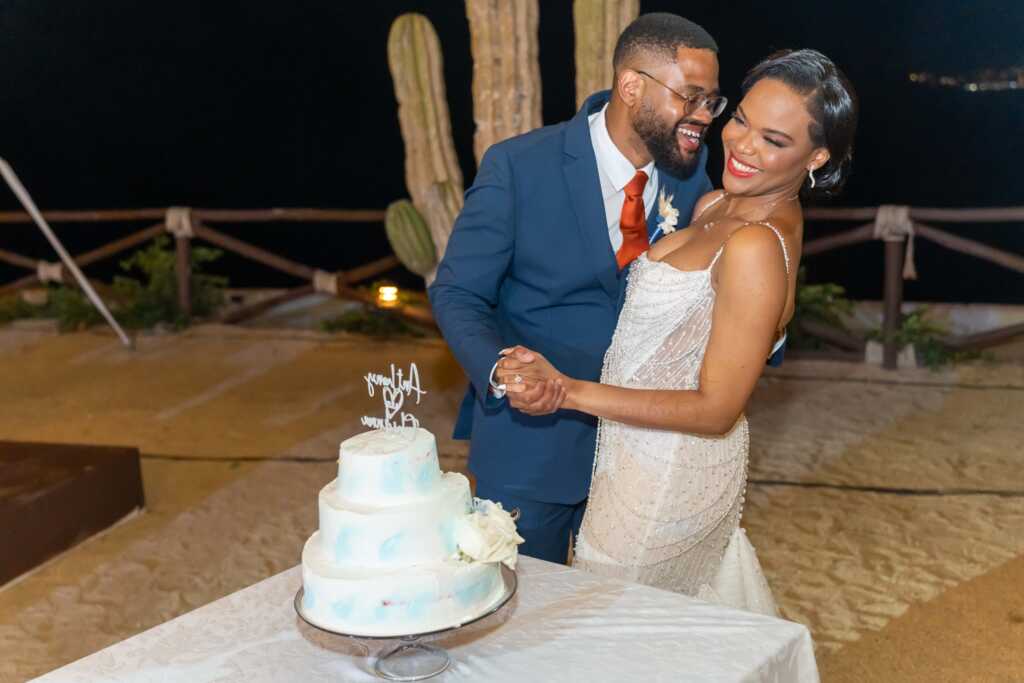Bride and groom cutting cake Hacienda Encantada Cabo wedding