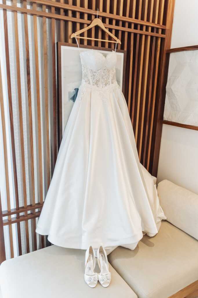 Bride’s wedding dress hanging at Nobu Hotel Los Cabos before an intimate destination wedding.